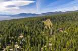 Discover your dream mountain retreat nestled amidst a dense forest with stunning lake and mountain views.