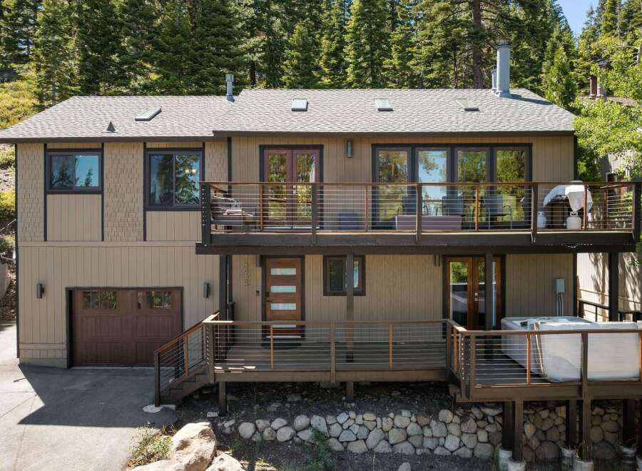 Experience luxury mountain living in this stunning multi-level home, featuring expansive decks perfect for entertaining or enjoying the serene forest views.