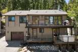 Experience luxury mountain living in this stunning multi-level home, featuring expansive decks perfect for entertaining or enjoying the serene forest views.