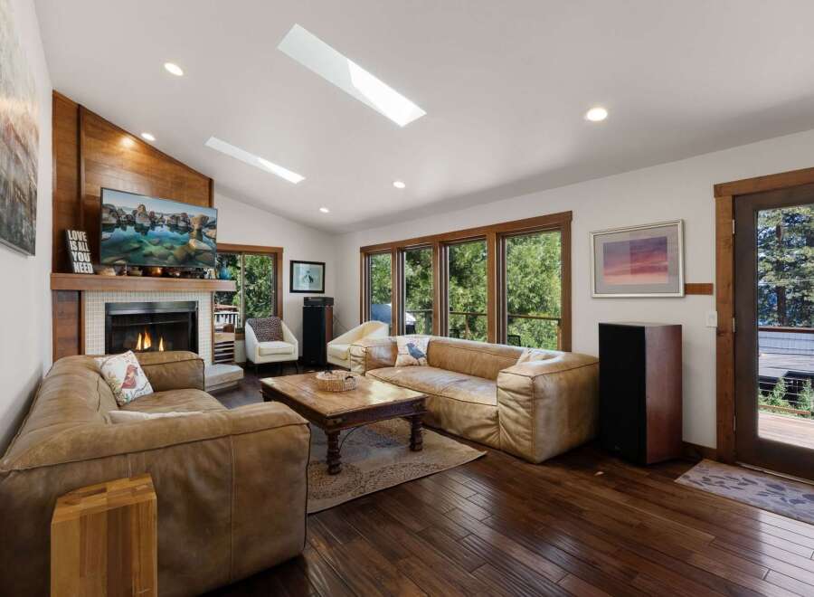 Experience ultimate comfort in this spacious living room, featuring plush leather sofas perfect for relaxation.