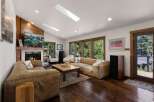 Experience ultimate comfort in this spacious living room, featuring plush leather sofas perfect for relaxation.