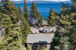 Experience breathtaking lake views from this stunning property nestled among tall pine trees.