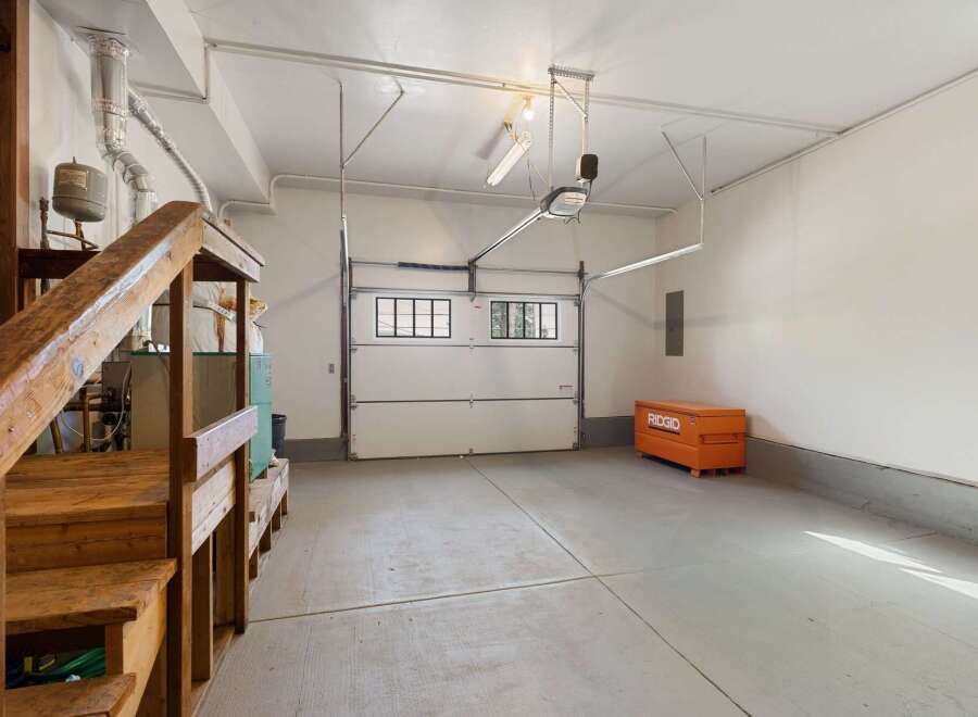 This spacious garage offers ample storage and workspace, perfect for any homeowner.