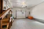 This spacious garage offers ample storage and workspace, perfect for any homeowner.