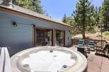 Relax and unwind in this stunning mountain retreat, featuring a luxurious hot tub perfect for soaking under the stars.