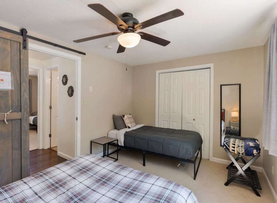 This charming bedroom features two comfortable beds, perfect for accommodating guests or family.