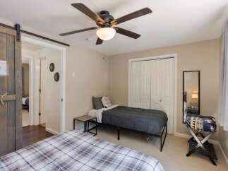 This charming bedroom features two comfortable beds, perfect for accommodating guests or family.