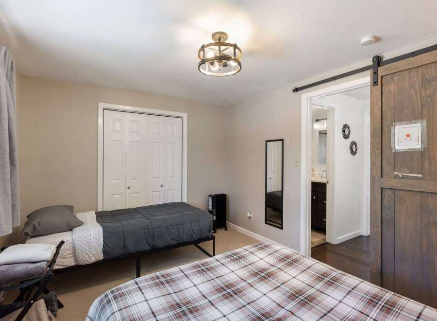 This charming bedroom features two comfortable beds, perfect for accommodating guests or family.