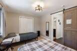 This charming bedroom features two comfortable beds, perfect for accommodating guests or family.
