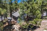 Escape to this charming mountain retreat, nestled amongst tall pine trees.