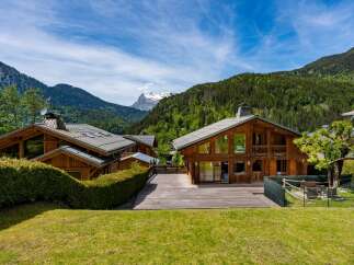 Experience luxury mountain living in this stunning wooden chalet, nestled amidst breathtaking alpine scenery.