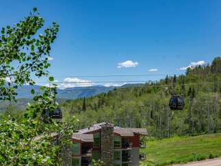 Experience breathtaking mountain views from this stunning property, featuring modern architecture and convenient access to ski lifts.