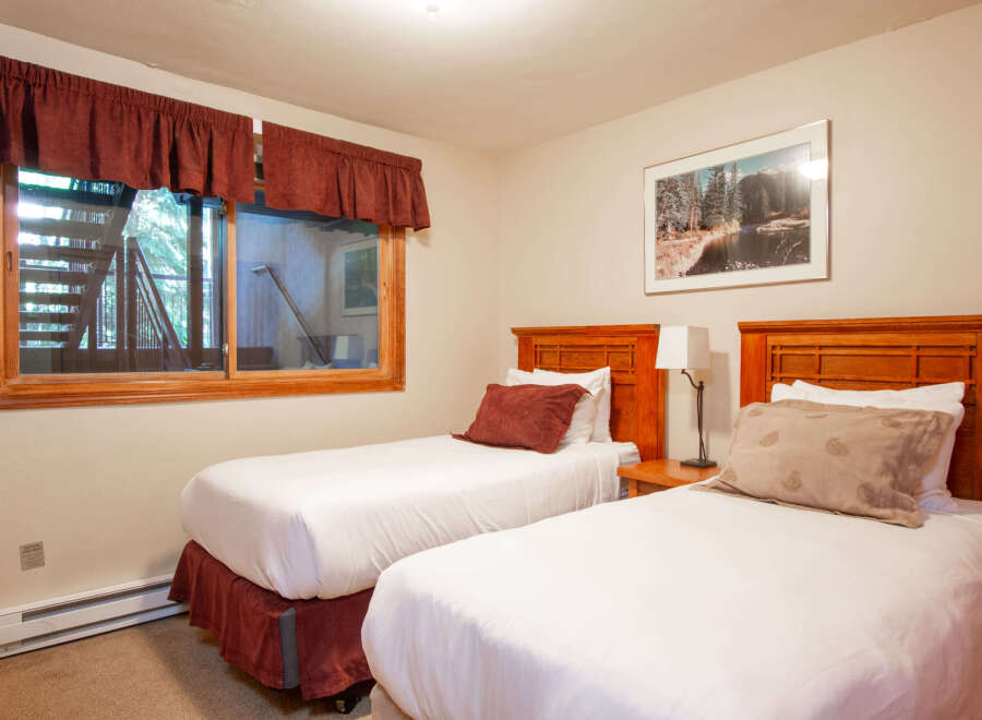 This charming bedroom features two comfortable twin beds, perfect for accommodating guests or family.