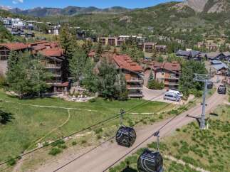 Experience mountain living at its finest with this stunning property featuring ski-in/ski-out access and breathtaking views.