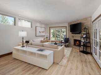 Experience modern living in this beautifully appointed living room, featuring a plush sectional sofa perfect for relaxation.