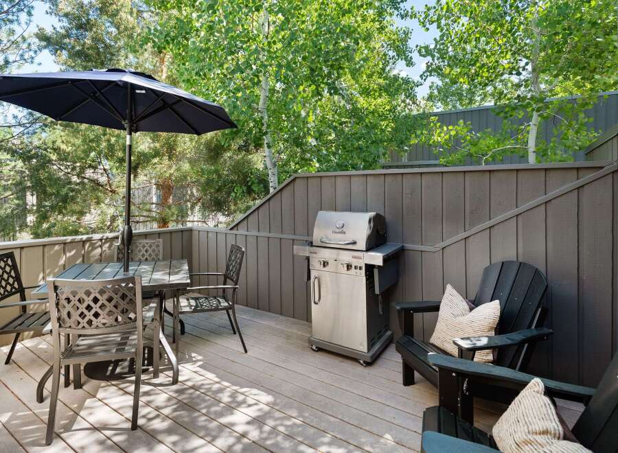 Enjoy outdoor living on this spacious deck, perfect for entertaining or relaxing.