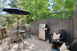 Enjoy outdoor living on this spacious deck, perfect for entertaining or relaxing.