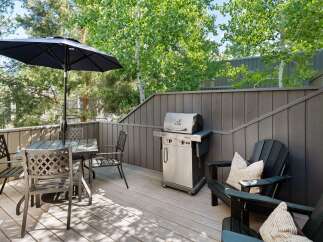 Enjoy outdoor living on this spacious deck, perfect for entertaining or relaxing.
