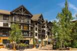 Discover luxury mountain living in this stunning property, featuring a modern alpine architectural style with exposed timber beams and stone accents.