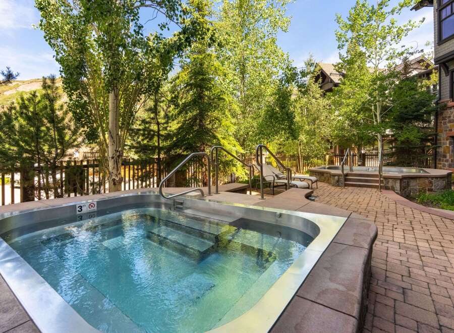 Relax and unwind in this luxurious outdoor hot tub, perfect for soaking up the mountain views.