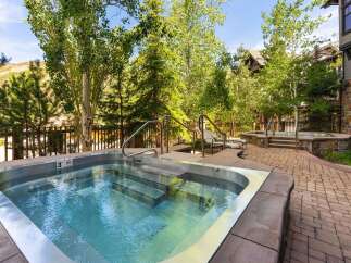 Relax and unwind in this luxurious outdoor hot tub, perfect for soaking up the mountain views.
