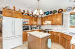 This charming kitchen boasts beautiful oak cabinetry, offering ample storage and a warm, inviting aesthetic.