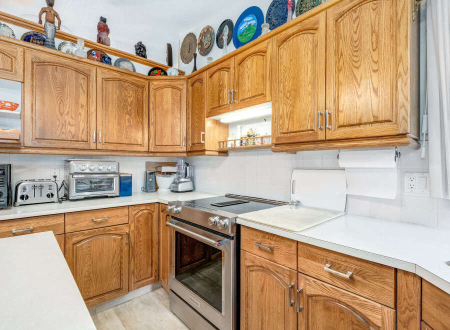 This kitchen boasts beautiful oak cabinetry, offering ample storage and a warm, inviting aesthetic.