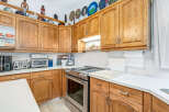 This kitchen boasts beautiful oak cabinetry, offering ample storage and a warm, inviting aesthetic.