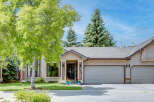 This charming home features a welcoming entrance with decorative planters and a prominent house number '170'.