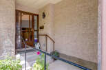 Welcome guests to this charming home with a welcoming covered porch, perfect for enjoying your morning coffee.