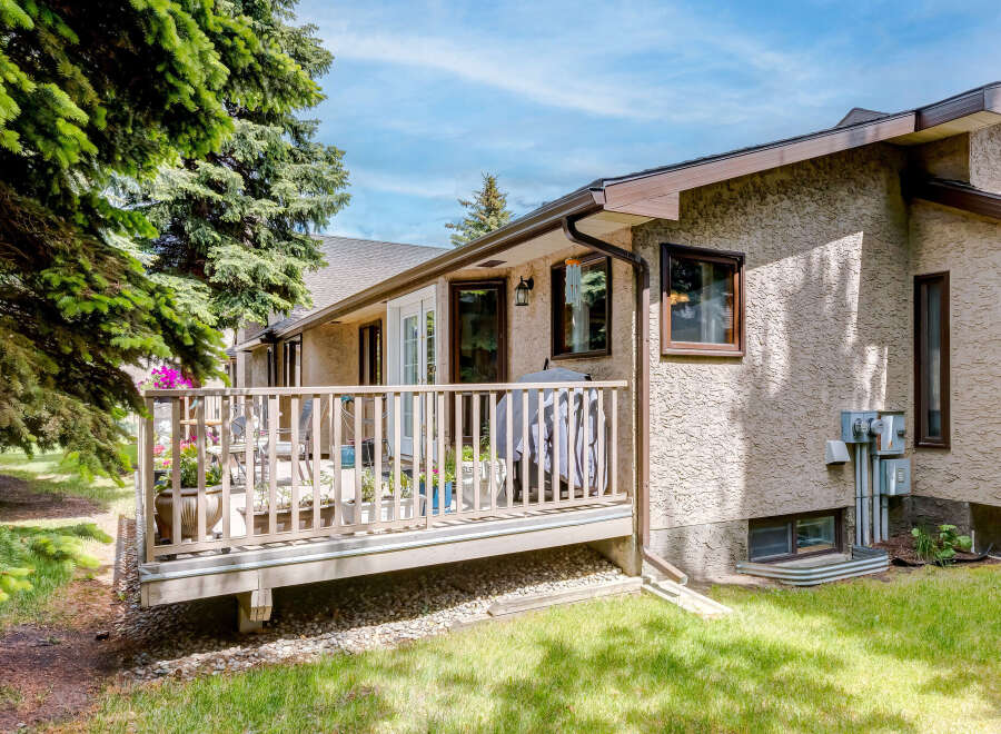 Enjoy outdoor living on this spacious deck, perfect for entertaining or relaxing.