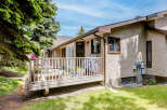 Enjoy outdoor living on this spacious deck, perfect for entertaining or relaxing.