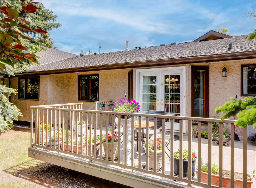 Enjoy outdoor living on this charming deck, perfect for relaxing or entertaining.