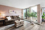 Experience comfortable living in this inviting living room, featuring a plush brown sofa perfect for relaxation.