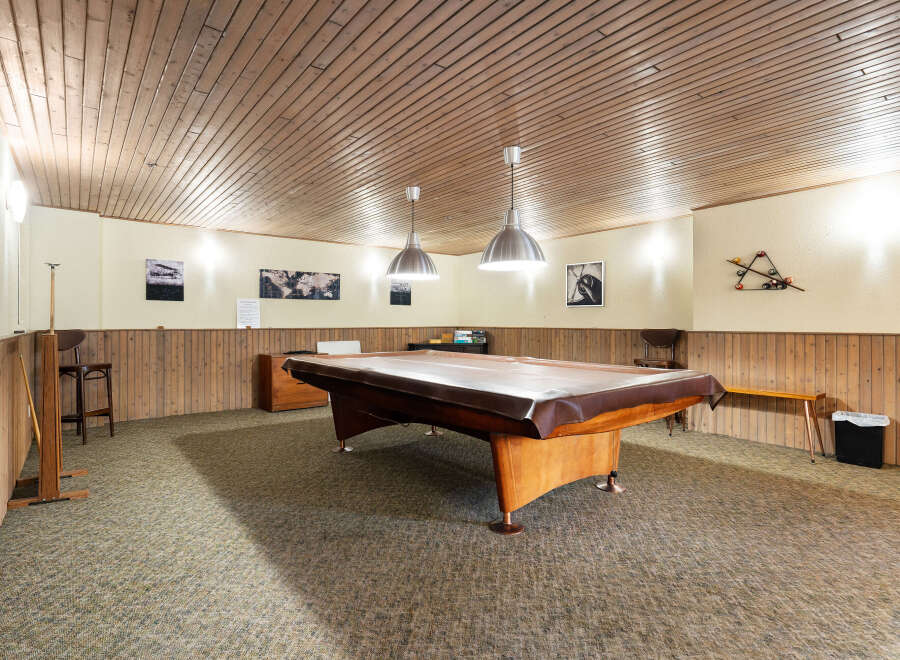 Step into this charming game room, perfect for entertaining guests or enjoying a relaxed evening.