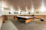 Step into this charming game room, perfect for entertaining guests or enjoying a relaxed evening.