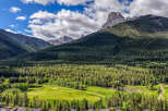 Experience luxury living nestled amidst breathtaking mountain scenery and a pristine golf course.