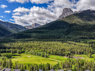 Experience luxury living nestled amidst breathtaking mountain scenery and a pristine golf course.