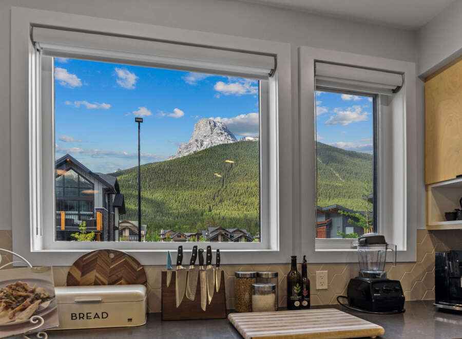 Experience breathtaking mountain views from this stunning kitchen, perfect for those who love to cook with a view.