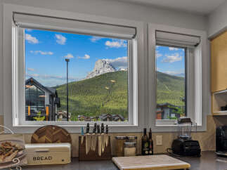 Experience breathtaking mountain views from this stunning kitchen, perfect for those who love to cook with a view.