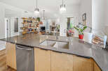 Experience modern living in this stunning open-concept kitchen and living area, perfect for entertaining.