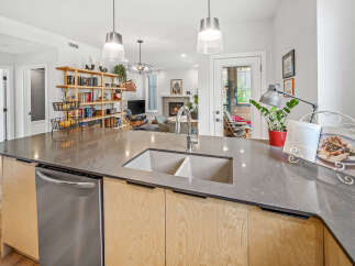Experience modern living in this stunning open-concept kitchen and living area, perfect for entertaining.