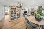 Experience modern living in this beautifully appointed open-concept space, featuring a cozy fireplace and a stylish entertainment area.