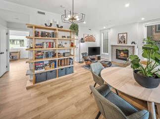 Experience modern living in this beautifully appointed open-concept space, featuring a cozy fireplace and a stylish entertainment area.