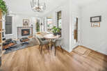 Experience modern living in this stylish living room featuring a cozy fireplace and a comfortable seating area.