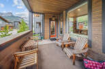 Enjoy breathtaking mountain views from this spacious covered balcony, perfect for outdoor dining or relaxing.