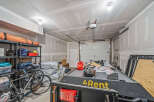 This spacious garage offers ample storage solutions with multi-tiered shelving units perfect for organizing tools and equipment.