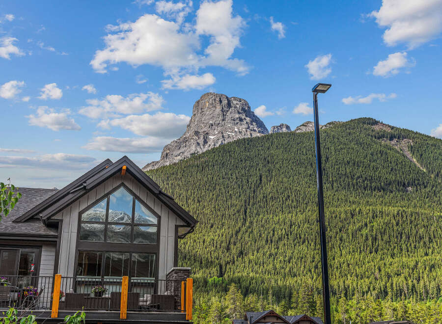 Experience breathtaking mountain views from this stunning property, featuring a modern home with expansive windows that capture the majestic scenery.