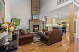 Experience luxury living in this stunning home featuring a grand stone fireplace as the centerpiece of the living room.