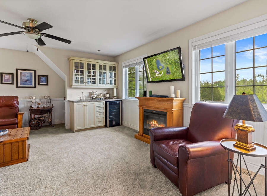 This inviting living space features a cozy fireplace, perfect for relaxing evenings.